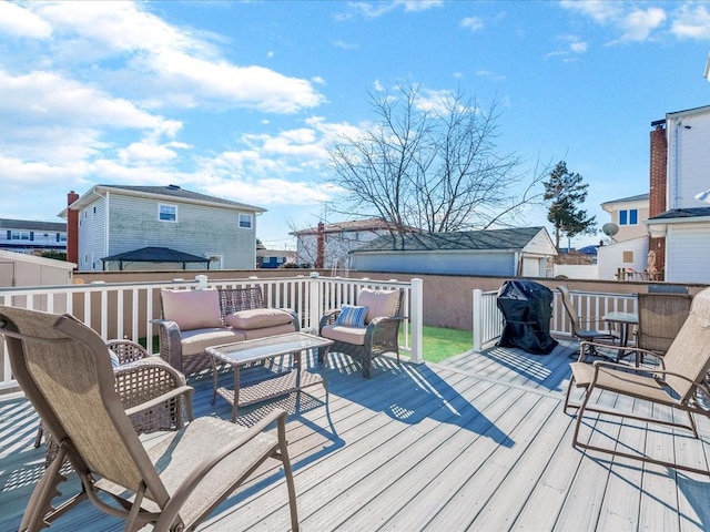 wooden deck featuring an outdoor living space