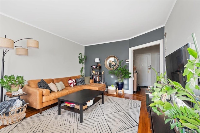 living room featuring crown molding and light hardwood / wood-style flooring