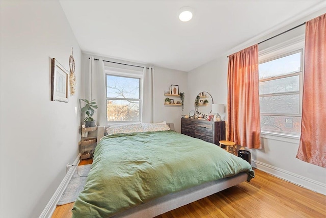 bedroom with hardwood / wood-style flooring