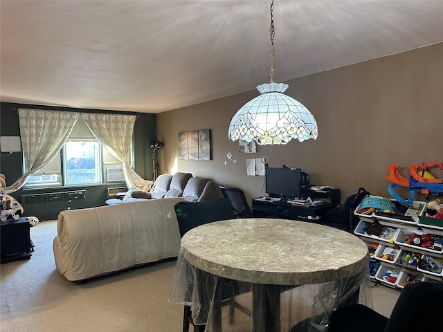 dining room with radiator heating unit and carpet flooring