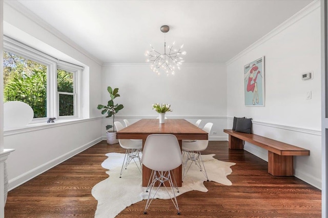 dining room featuring a chandelier, wood finished floors, and ornamental molding