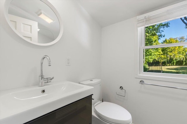 half bath with toilet and vanity