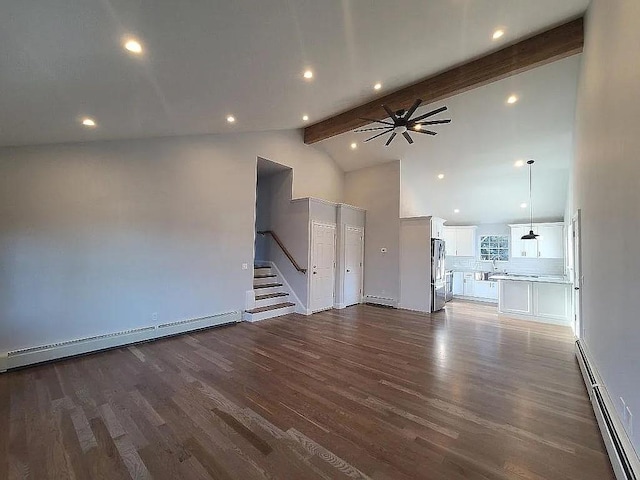 unfurnished living room featuring dark wood-type flooring, beamed ceiling, and baseboard heating