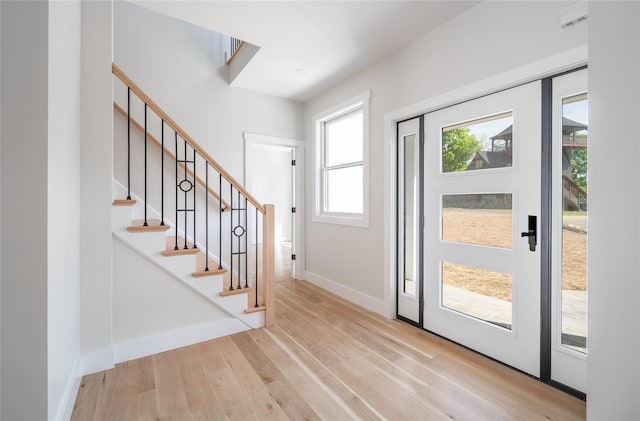 foyer with light wood-type flooring