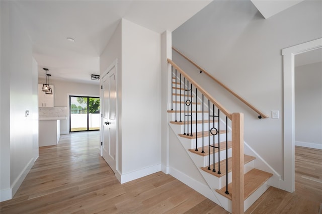 stairway with wood-type flooring