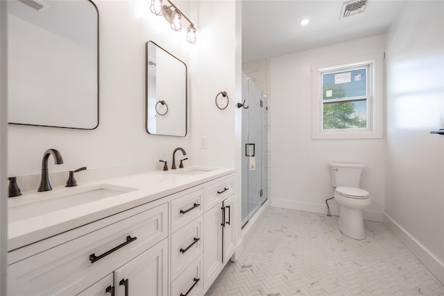 bathroom with vanity, toilet, and walk in shower