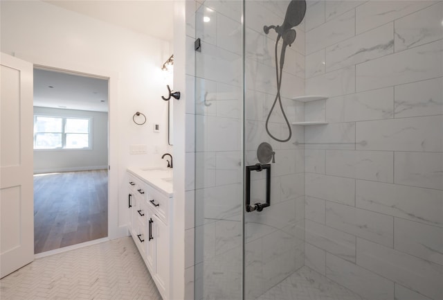 bathroom featuring vanity and an enclosed shower