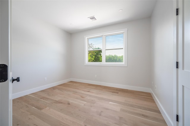 spare room featuring light hardwood / wood-style flooring