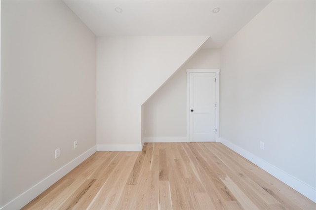 additional living space featuring light wood-type flooring