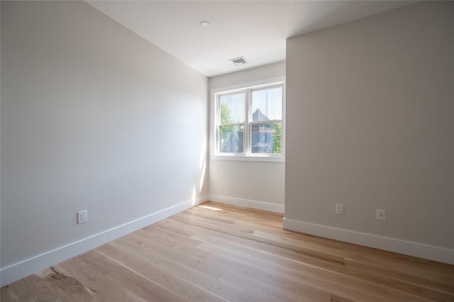 spare room with light hardwood / wood-style floors