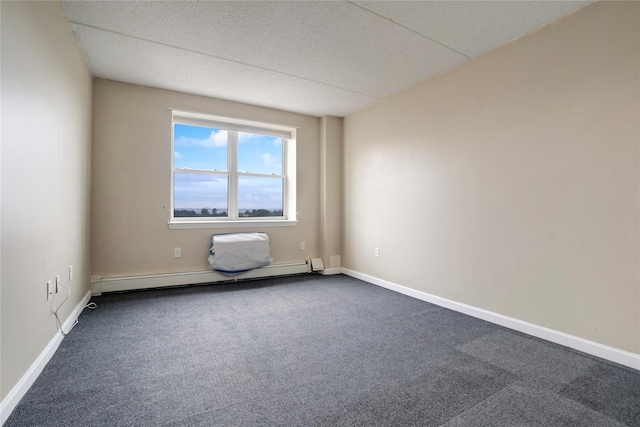 unfurnished room featuring carpet flooring and baseboard heating