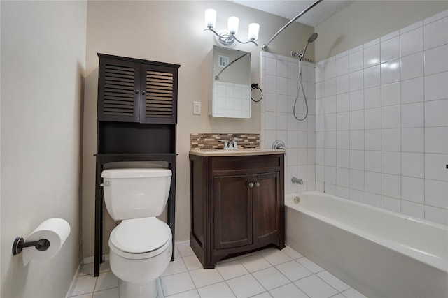 full bathroom featuring vanity, tasteful backsplash, tile patterned floors, toilet, and tiled shower / bath