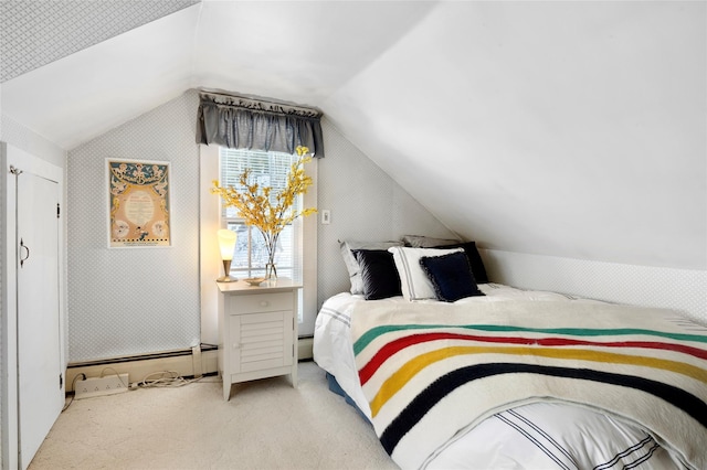 carpeted bedroom featuring lofted ceiling and a baseboard heating unit