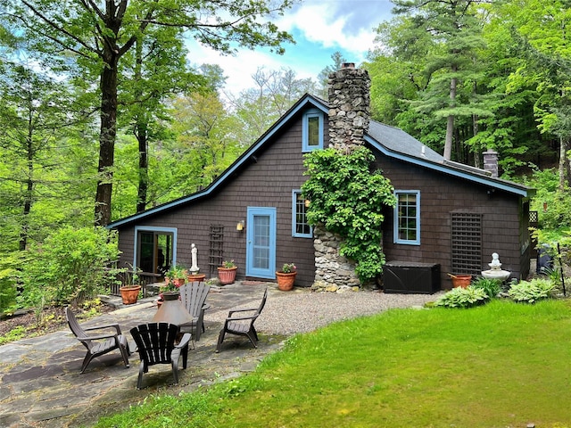 326 Pratt Hill Rd, Austerlitz, NY 12017 - rear view of property featuring a chimney, a patio, and a yard