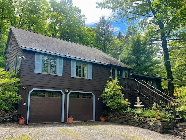 326 Pratt Hill Rd, Austerlitz, NY 12017 - view of front facade featuring a garage, roof with shingles, stairs, driveway, and a wooden deck