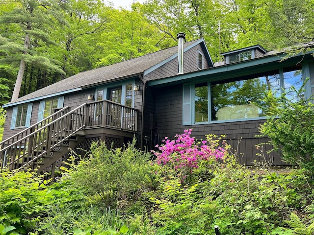 326 Pratt Hill Rd, Austerlitz, NY 12017 - view of front of property featuring stairway, roof with shingles, and a deck
