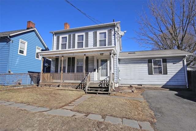 colonial home featuring a porch