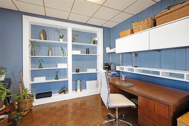 office area featuring built in features and a drop ceiling