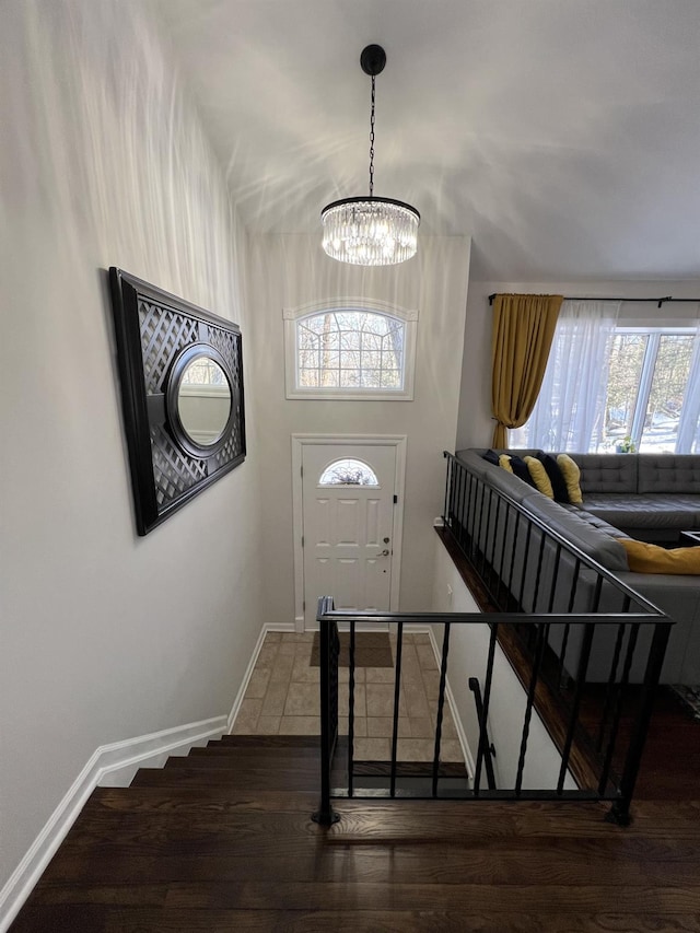 foyer with a chandelier