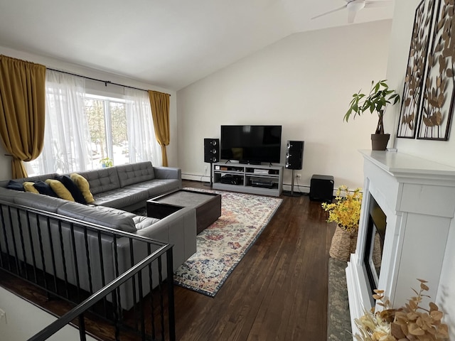 living room with dark wood-type flooring, vaulted ceiling, ceiling fan, and baseboard heating