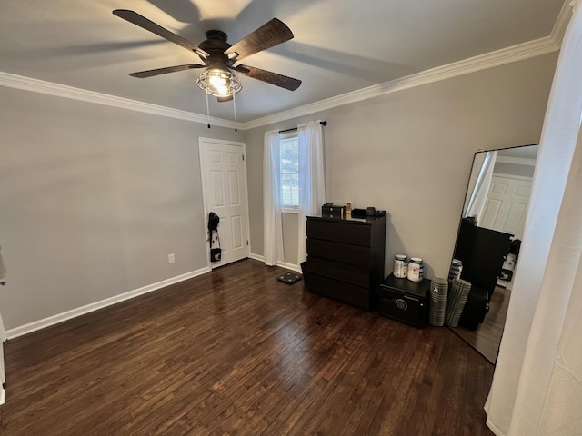 bedroom with ornamental molding, dark wood-type flooring, and ceiling fan