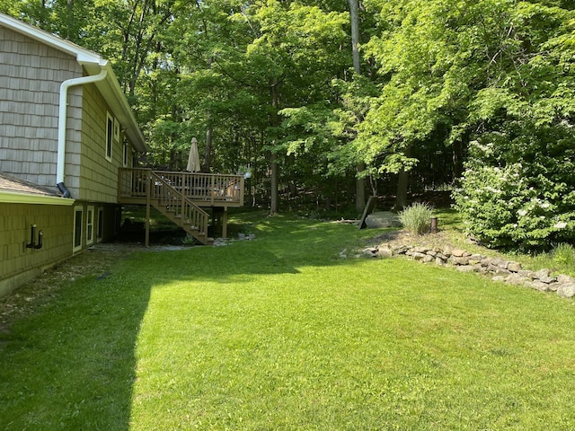 view of yard featuring a wooden deck