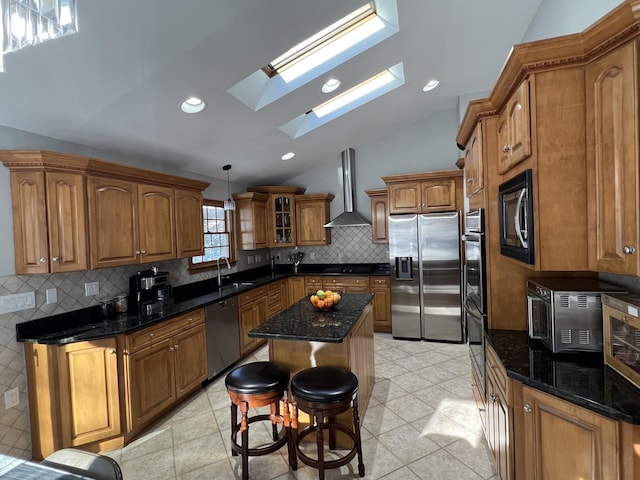 1179 E Mombasha Rd, Monroe, NY 10950 - kitchen with wall chimney exhaust hood, black appliances, vaulted ceiling, brown cabinets, and a sink