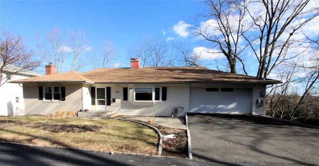 single story home with a garage