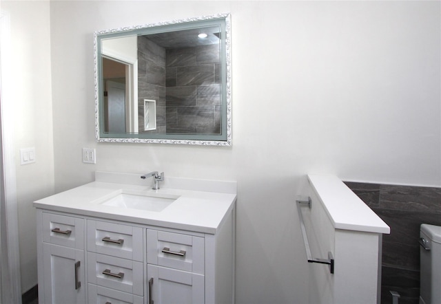 bathroom with vanity and toilet