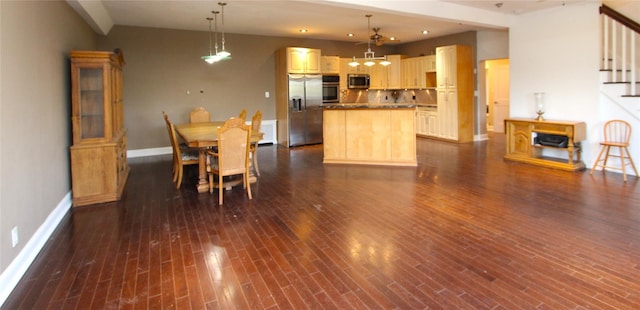 dining area featuring dark wood-type flooring