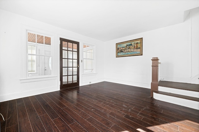 unfurnished room with dark hardwood / wood-style floors