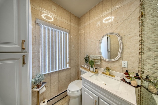 bathroom featuring tile walls, backsplash, vanity, a baseboard radiator, and toilet