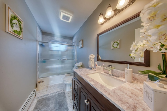 full bathroom featuring bath / shower combo with glass door, vanity, baseboard heating, toilet, and tile patterned floors