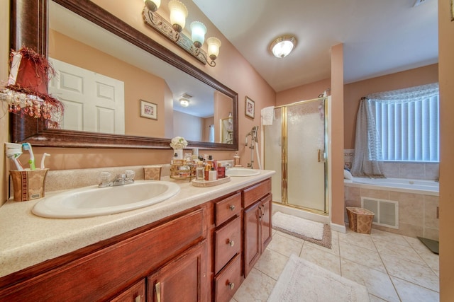 bathroom featuring tile patterned flooring, vanity, and independent shower and bath