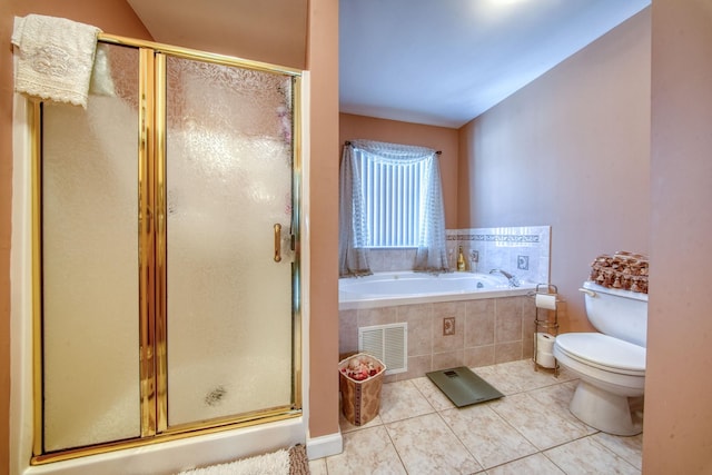 bathroom with vaulted ceiling, separate shower and tub, tile patterned floors, and toilet