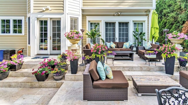 view of patio with an outdoor living space and french doors