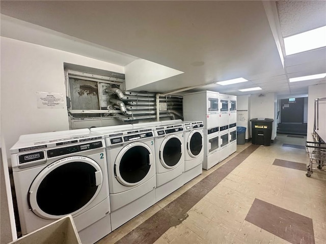 laundry room featuring stacked washer / dryer and washer and dryer