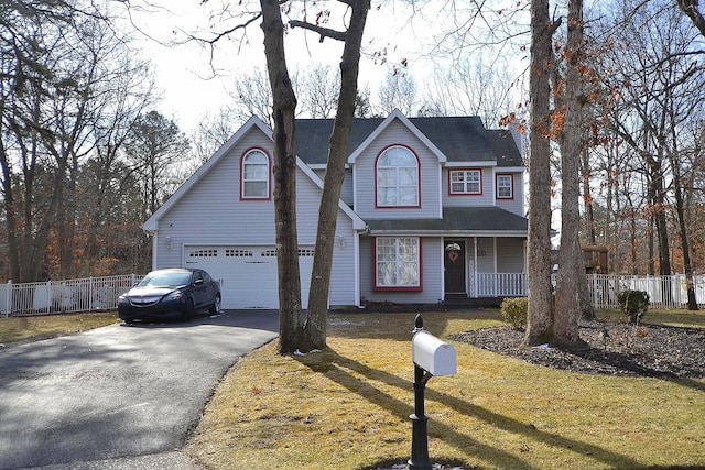 front of property featuring a front lawn and covered porch