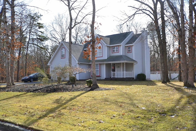 view of front property featuring a front lawn and a porch