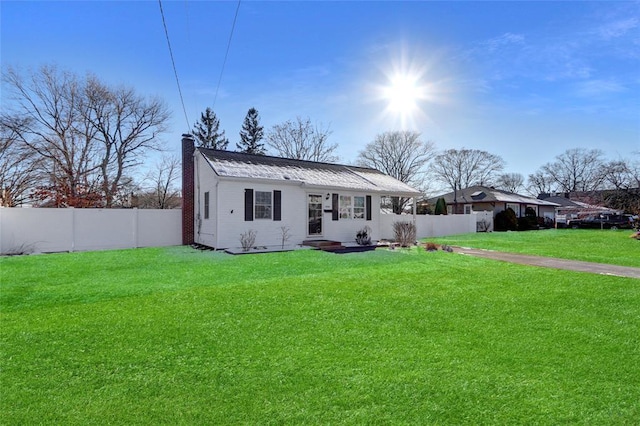 ranch-style home with a front lawn