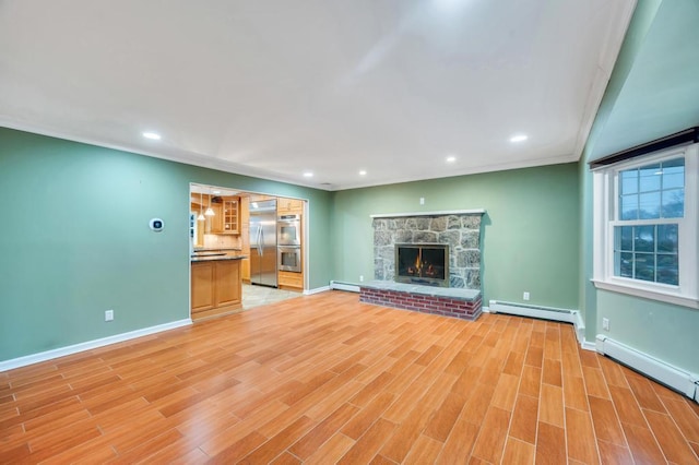 unfurnished living room featuring a baseboard radiator, a stone fireplace, and light wood-type flooring