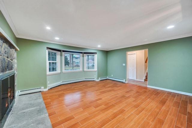 unfurnished living room with crown molding, a fireplace, light hardwood / wood-style floors, and a baseboard heating unit