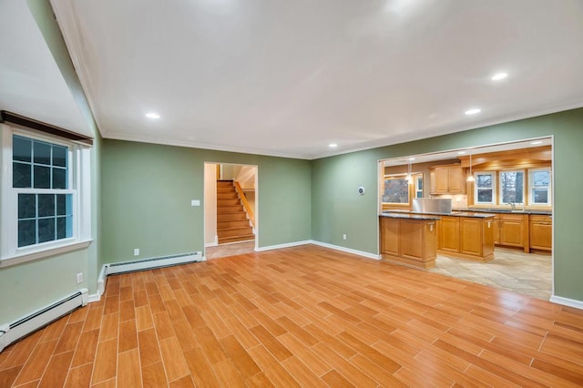 unfurnished living room with a baseboard radiator, crown molding, and light wood-type flooring