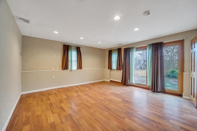 unfurnished room featuring light wood-type flooring