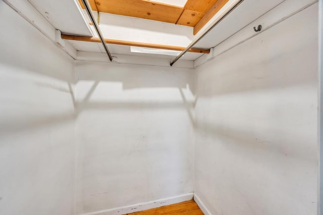 walk in closet featuring light hardwood / wood-style flooring