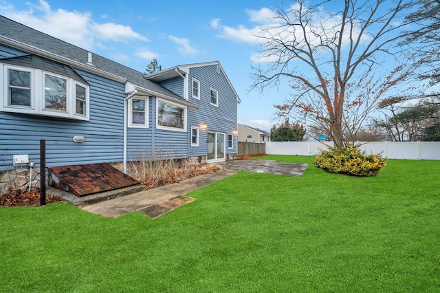 back of house featuring a yard