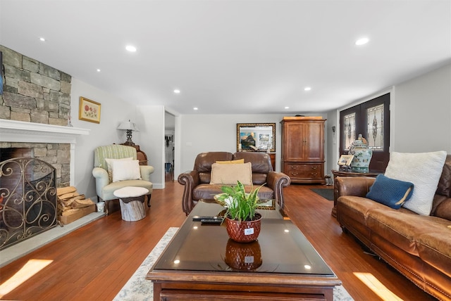 living room featuring hardwood / wood-style floors and a fireplace