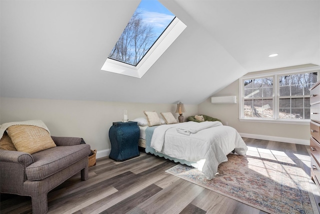 bedroom featuring lofted ceiling with skylight and dark hardwood / wood-style floors