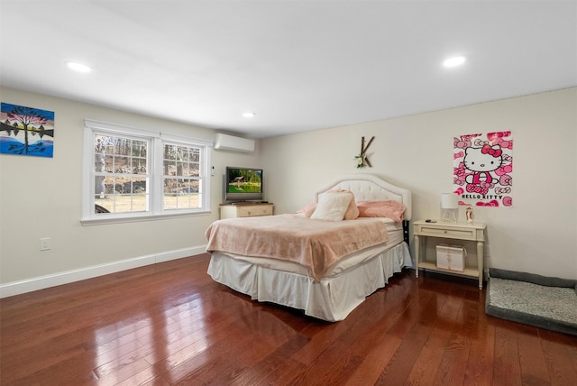 bedroom featuring dark wood-type flooring and a wall mounted air conditioner