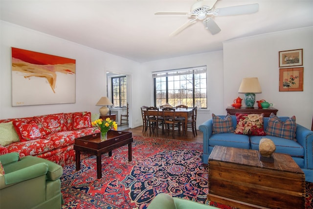 living room featuring hardwood / wood-style flooring and ceiling fan